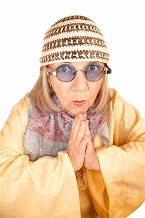 Crazy new age woman with hands together in a yellow robe Stock Photo - Budget Royalty-Free & Subscription, Code: 400-04663013
