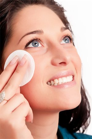 simsearch:400-04263334,k - Young woman removing makeup with cleansing pad isolated on white Foto de stock - Royalty-Free Super Valor e Assinatura, Número: 400-04663089