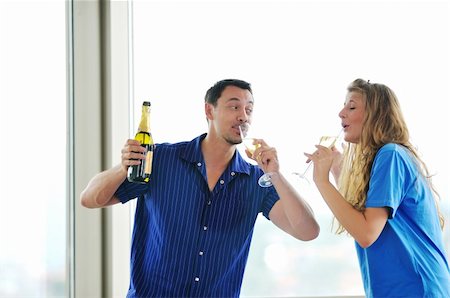 happy couple at big bright comfort apartment celebrate with glasses of champagne Stock Photo - Budget Royalty-Free & Subscription, Code: 400-04663573