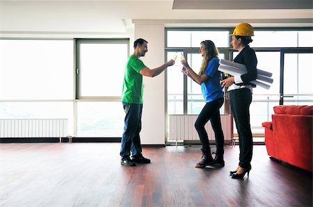 happy young couple buying new home with real estate agent and  looking big comfort bright apartment plans and taking key Stock Photo - Budget Royalty-Free & Subscription, Code: 400-04663864