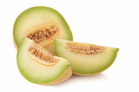 Galia melon in slices, isolated over white background. Stock Photo - Budget Royalty-Free & Subscription, Code: 400-04663942