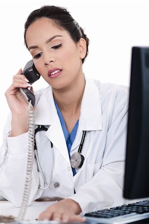 doctor business computer - Asian female doctor talking over phone in isolated white background Stock Photo - Budget Royalty-Free & Subscription, Code: 400-04674584
