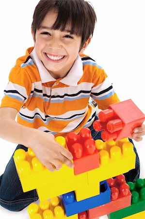 plastic toy family - Cute little boy play on white isolated background Stock Photo - Budget Royalty-Free & Subscription, Code: 400-04674680