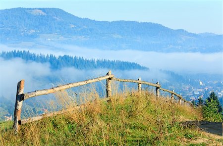 simsearch:400-04306537,k - countryside landscape with wooden fence and mountain behind Stock Photo - Budget Royalty-Free & Subscription, Code: 400-04674787