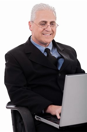 simsearch:400-04111366,k - Mature business man in working with laptop on white background Foto de stock - Royalty-Free Super Valor e Assinatura, Número: 400-04674824