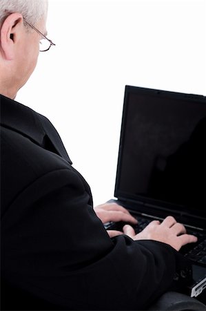 simsearch:400-04111366,k - Rear view of business man working in laptop on white background Foto de stock - Royalty-Free Super Valor e Assinatura, Número: 400-04674829