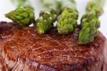 simsearch:400-04875293,k - closeup of a beef steak with green asparagus on a white background Stock Photo - Budget Royalty-Free & Subscription, Code: 400-04674839