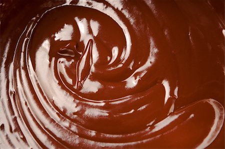 simsearch:400-04887409,k - Close up of melted milk chocolate swirl. Stockbilder - Microstock & Abonnement, Bildnummer: 400-04674932