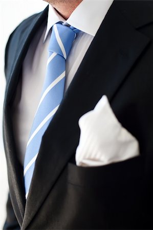 Groom wearing dark suit and a blue tie. Stock Photo - Budget Royalty-Free & Subscription, Code: 400-04675125