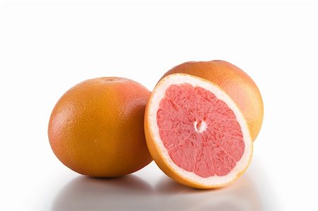 Small group of grapefruits isolated on white background Fotografie stock - Microstock e Abbonamento, Codice: 400-04675264