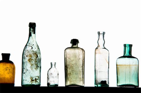 old bottles in a row on white Stock Photo - Budget Royalty-Free & Subscription, Code: 400-04675402