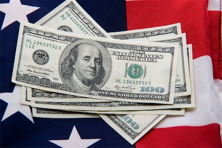 simsearch:400-05140548,k - Close-up of several hundred dollars on USA flag Stock Photo - Budget Royalty-Free & Subscription, Code: 400-04675449