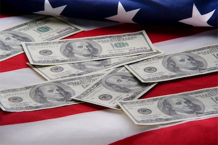 simsearch:400-05140548,k - Close up money on USA flag Stock Photo - Budget Royalty-Free & Subscription, Code: 400-04675451