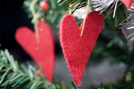 Heart shape Christmas decorations hanging in a Christmas tree Stock Photo - Budget Royalty-Free & Subscription, Code: 400-04675805