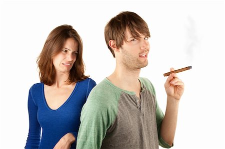 Woman reacts to man with smelly cigar Stock Photo - Budget Royalty-Free & Subscription, Code: 400-04675896