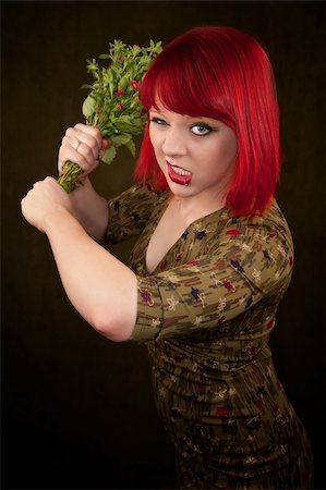 simsearch:400-06330521,k - Pretty punky girl with brightly dyed red hair and flowers Photographie de stock - Aubaine LD & Abonnement, Code: 400-04675903