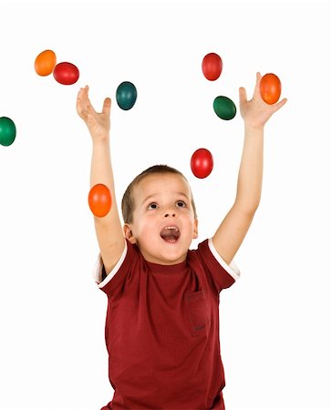Little ecstatic boy with falling easter eggs - isolated Stock Photo - Budget Royalty-Free & Subscription, Code: 400-04675973