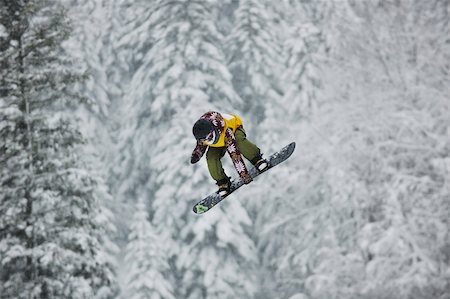 simsearch:400-04013663,k - young boys jumping in air ind showing trick with snowboard at winter season Stock Photo - Budget Royalty-Free & Subscription, Code: 400-04676176