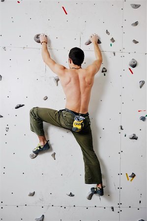 young and fit man exercise free mountain climbing on indoor practice wall Stock Photo - Budget Royalty-Free & Subscription, Code: 400-04676186