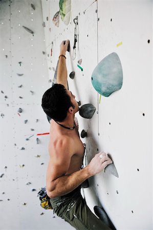 young and fit man exercise free mountain climbing on indoor practice wall Stock Photo - Budget Royalty-Free & Subscription, Code: 400-04676190