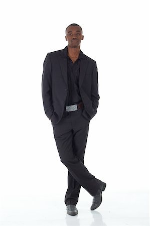simsearch:400-04662774,k - Young Adult black african businessman wearing a dark smart-casual suit and Jacket on a white background in various poses with various facial expressions. Part of a series, Not Isolated. Foto de stock - Royalty-Free Super Valor e Assinatura, Número: 400-04676409