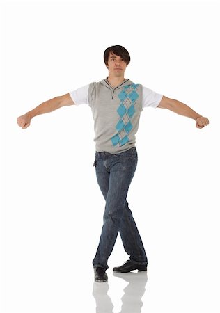 Single Caucasian male tap dancer wearing jeans showing various steps in studio with white background and reflective floor. Not isolated Stock Photo - Budget Royalty-Free & Subscription, Code: 400-04676575