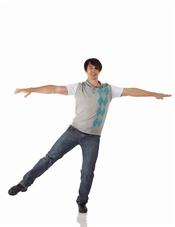 Single Caucasian male tap dancer wearing jeans showing various steps in studio with white background and reflective floor. Not isolated Stock Photo - Budget Royalty-Free & Subscription, Code: 400-04676609