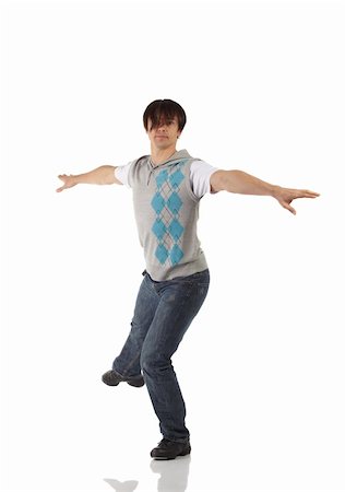 Single Caucasian male tap dancer wearing jeans showing various steps in studio with white background and reflective floor. Not isolated Stock Photo - Budget Royalty-Free & Subscription, Code: 400-04676610