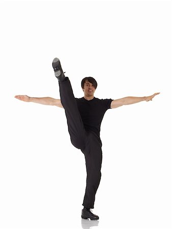 Single Caucasian male tap dancer wearing black pants showing various steps in studio with white background and reflective floor. Not isolated Stock Photo - Budget Royalty-Free & Subscription, Code: 400-04676612