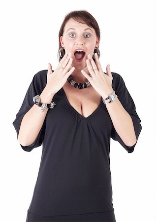 Cute young adult caucasian woman wearing a black outfit and a beaded necklace with black boots and brunette hair on a white background. Not Isolated Stock Photo - Budget Royalty-Free & Subscription, Code: 400-04676645