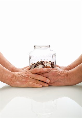 simsearch:614-06002344,k - Senior hands holding a jar with coins - retirement fund concept, isolated Foto de stock - Super Valor sin royalties y Suscripción, Código: 400-04677598