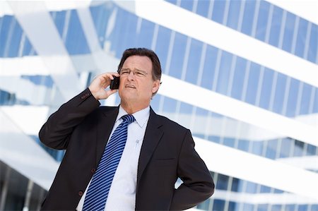 simsearch:400-04608943,k - Concerned, Stressed Businessman Talks on His Cell Phone. Stock Photo - Budget Royalty-Free & Subscription, Code: 400-04677915