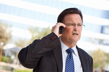 simsearch:400-04717565,k - Concerned, Stressed Businessman Talks on His Cell Phone. Stock Photo - Budget Royalty-Free & Subscription, Code: 400-04677912