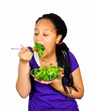 Isolated portrait of black teenage girl eating salad Foto de stock - Super Valor sin royalties y Suscripción, Código: 400-04678053