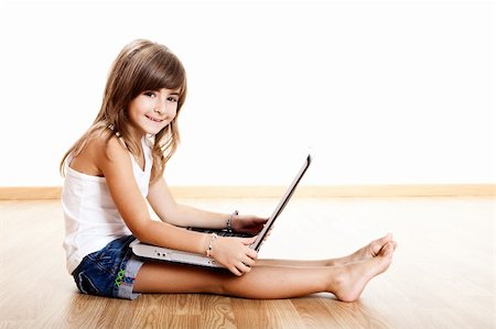 simsearch:400-04129482,k - Happy little child learning how to use a laptop Photographie de stock - Aubaine LD & Abonnement, Code: 400-04678176