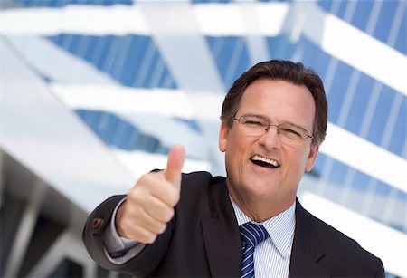 simsearch:400-04963726,k - Handsome, Confident Businessman Outside of Corporate Building with Thumbs Up. Stock Photo - Budget Royalty-Free & Subscription, Code: 400-04678366