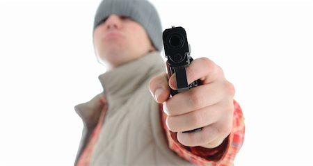 simsearch:400-04577380,k - Young man is aiming with gun. Isolated on white. Fotografie stock - Microstock e Abbonamento, Codice: 400-04678880