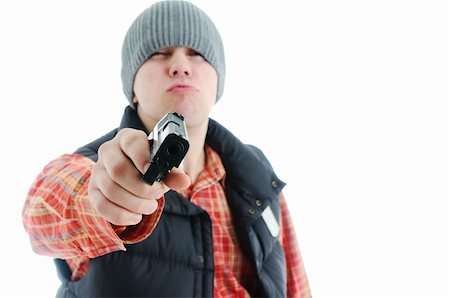 Young man is aiming with gun. Isolated on white. Stock Photo - Budget Royalty-Free & Subscription, Code: 400-04678881