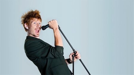 rock singer screaming into mic - Super rock star lead singer belts out a high note Stock Photo - Budget Royalty-Free & Subscription, Code: 400-04679237