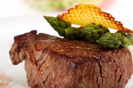 simsearch:400-04875293,k - closeup of a beef steak with green asparagus on a white background Stock Photo - Budget Royalty-Free & Subscription, Code: 400-04679297