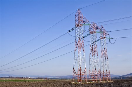 simsearch:400-04364211,k - Power lines over rural landscape and deep blue sky Photographie de stock - Aubaine LD & Abonnement, Code: 400-04679578