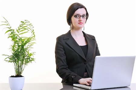 one young business woman isolated on white working on laptop computer Stock Photo - Budget Royalty-Free & Subscription, Code: 400-04679998