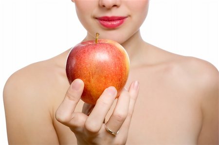 simsearch:400-04564926,k - young blonde woman offering red apple, shallow DOF, Focus on the apple Photographie de stock - Aubaine LD & Abonnement, Code: 400-04670105