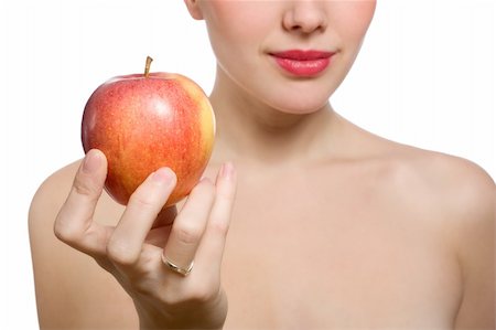 simsearch:400-04564926,k - young blonde woman offering red apple, shallow DOF, Focus on the apple Photographie de stock - Aubaine LD & Abonnement, Code: 400-04670106