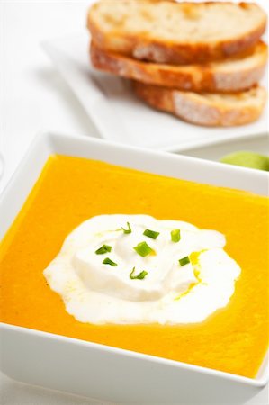 pumpkin soup and baguette isolated on white Stock Photo - Budget Royalty-Free & Subscription, Code: 400-04670218