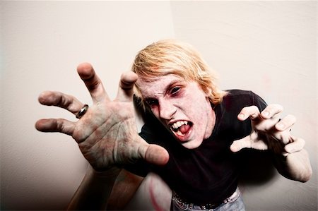 simsearch:400-06769146,k - Young male zombie or vampire trapped in a corner Stock Photo - Budget Royalty-Free & Subscription, Code: 400-04670407