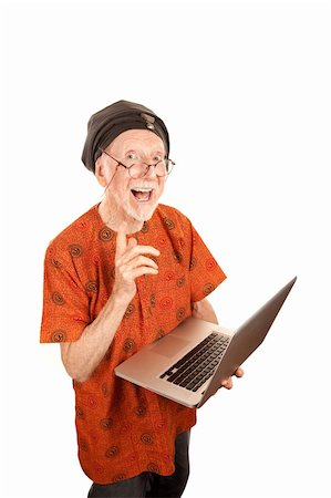 elderly doubt - Senior computer guru with shiny silver laptop Stock Photo - Budget Royalty-Free & Subscription, Code: 400-04670414