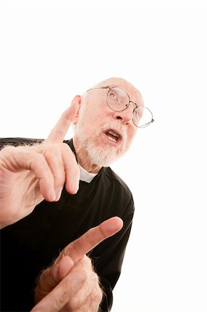 simsearch:400-04278950,k - Priest or pastor giving a fiery sermon with fingers in the air Fotografie stock - Microstock e Abbonamento, Codice: 400-04670455