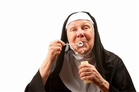 simsearch:400-04671065,k - Funney Nun in Religious Habit and Veil Blowing Bubbles Stock Photo - Budget Royalty-Free & Subscription, Code: 400-04670467