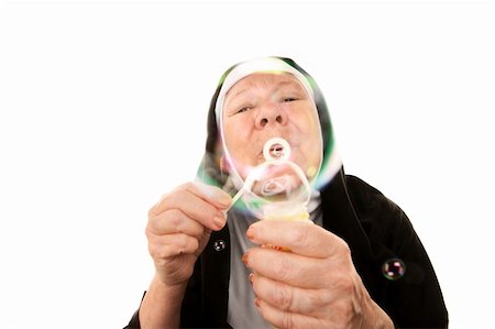 simsearch:400-04671065,k - Funny nun in religious habit blowing bubbles Stock Photo - Budget Royalty-Free & Subscription, Code: 400-04670460